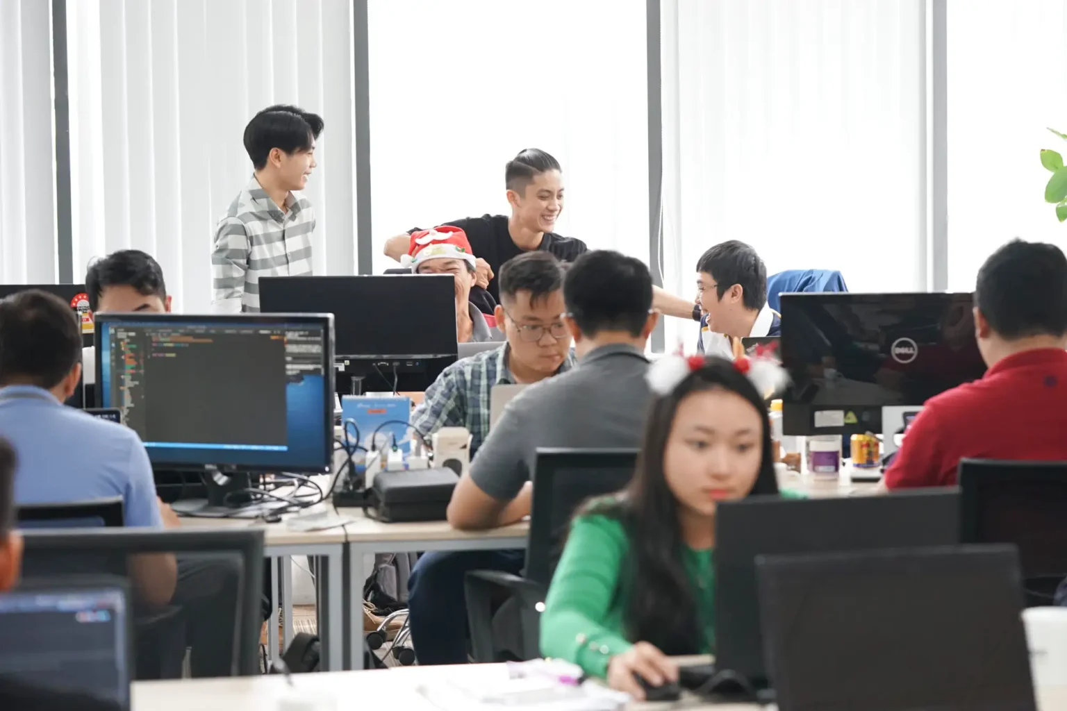 InApps engineers working at their desks in the Ho Chi Minh City office